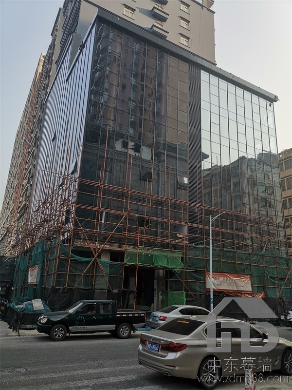 為什么現(xiàn)代建筑用玻璃幕墻？
